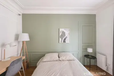Un ou plusieurs lits dans un hébergement de l'établissement Flexliving - Room - Lamarck