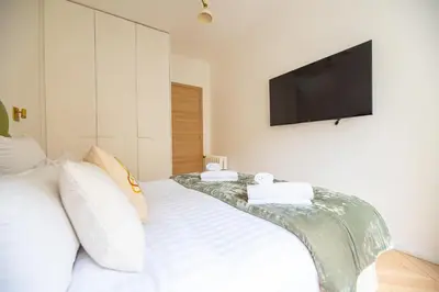 Un ou plusieurs lits dans un hébergement de l'établissement Luxury Flat Eiffel Tower View