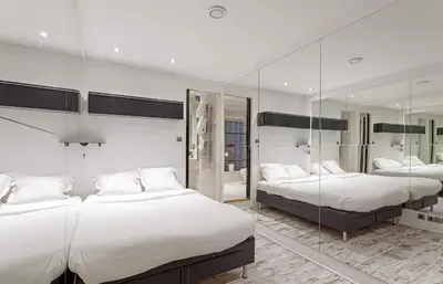 Un ou plusieurs lits dans un hébergement de l'établissement Modern 2BD Apartment 14 mins to the Eiffel Tower