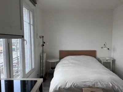 Un ou plusieurs lits dans un hébergement de l'établissement Studio Plein Soleil Seine