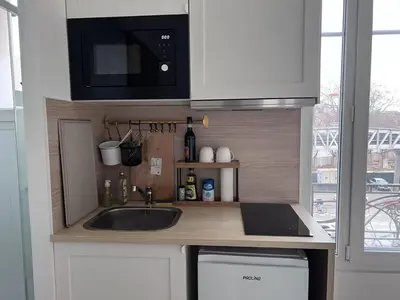 Cuisine ou kitchenette dans l'établissement Studio Plein Soleil Seine