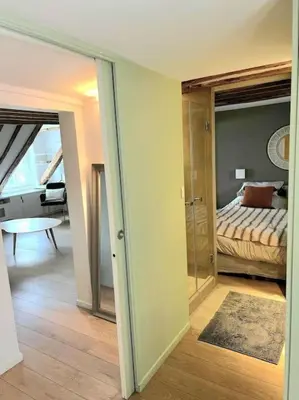Un ou plusieurs lits dans un hébergement de l'établissement Elegant Loft Place Vendôme