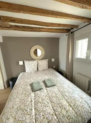 Un ou plusieurs lits dans un hébergement de l'établissement Elegant Loft Place Vendôme