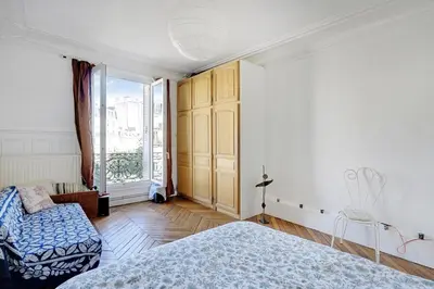 Un ou plusieurs lits dans un hébergement de l'établissement Appartement familial avec vue - République