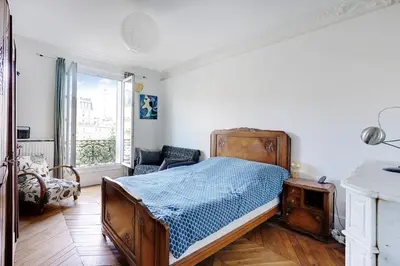 Un ou plusieurs lits dans un hébergement de l'établissement Appartement familial avec vue - République