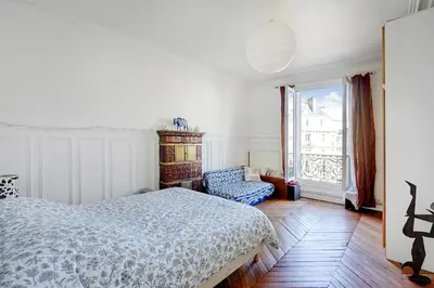 Un ou plusieurs lits dans un hébergement de l'établissement Appartement familial avec vue - République