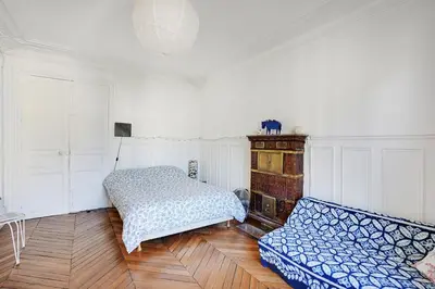 Un ou plusieurs lits dans un hébergement de l'établissement Appartement familial avec vue - République