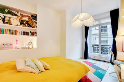 Un ou plusieurs lits dans un hébergement de l'établissement Appartement spacieux et élégant - Grds Boulevards