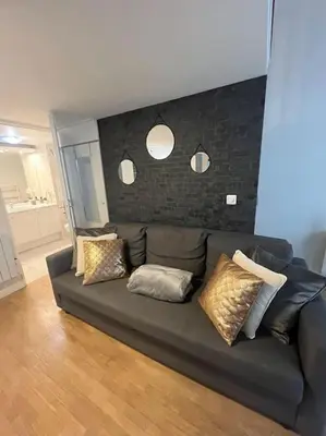 Coin salon dans l'établissement Magnifique duplex 45 m2 aux portes de Paris Metro Barbara à 30mn Expo Porte de Versailles