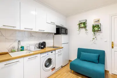 Cuisine ou kitchenette dans l'établissement GuestReady - Bel appartement cosy dans le 3e arr.