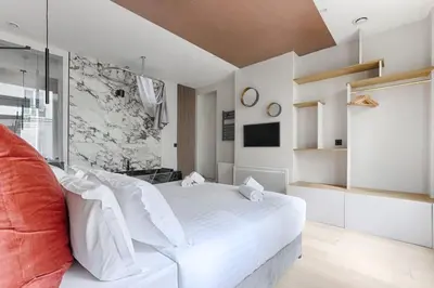 Un ou plusieurs lits dans un hébergement de l'établissement MyKeypers - Luxury Flat 3BR 8P with Jacuzzi - Haussmann