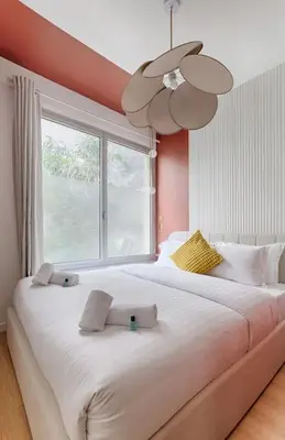 Un ou plusieurs lits dans un hébergement de l'établissement MyKeypers - Luxury Flat 3BR 8P with Jacuzzi - Haussmann