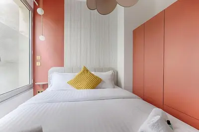 Un ou plusieurs lits dans un hébergement de l'établissement MyKeypers - Luxury Flat 3BR 8P with Jacuzzi - Haussmann
