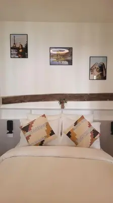 Un ou plusieurs lits dans un hébergement de l'établissement Zoé - Design 2BR Mouffetard