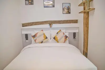 Un ou plusieurs lits dans un hébergement de l'établissement Zoé - Design 2BR Mouffetard
