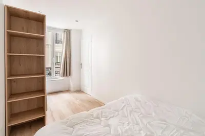 Un ou plusieurs lits dans un hébergement de l'établissement Appartement cosy canal Saint Martin