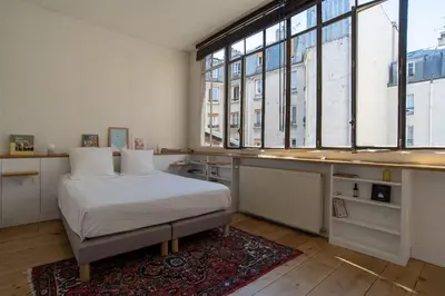 Un ou plusieurs lits dans un hébergement de l'établissement Sublime loft avec verrières sur le Canal St Martin