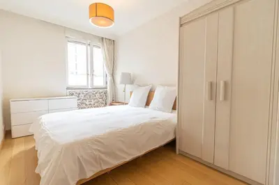 Un ou plusieurs lits dans un hébergement de l'établissement 5-bedroom spacious and cosy flat close to the Eiffel Tower
