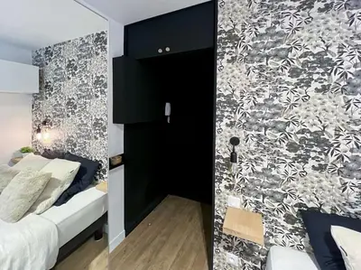 Un ou plusieurs lits dans un hébergement de l'établissement Fully renovated studio for 2