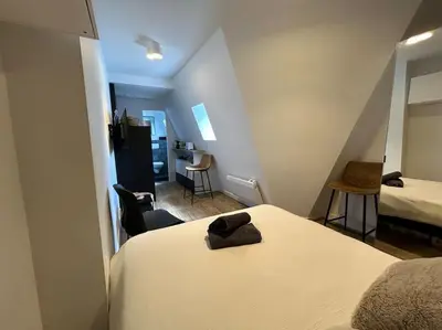 Un ou plusieurs lits dans un hébergement de l'établissement Fully renovated studio for 2