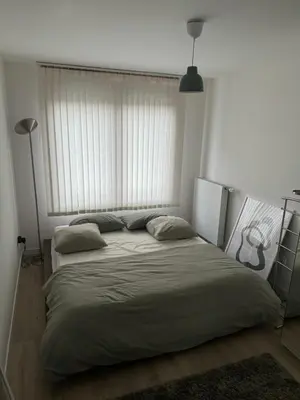 Un ou plusieurs lits dans un hébergement de l'établissement Appartement Cosy, proche Stade de France