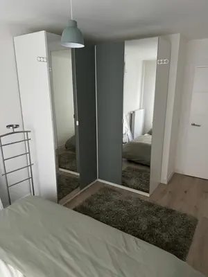 Un ou plusieurs lits dans un hébergement de l'établissement Appartement Cosy, proche Stade de France