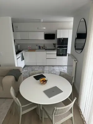 Cuisine ou kitchenette dans l'établissement Appartement Cosy, proche Stade de France