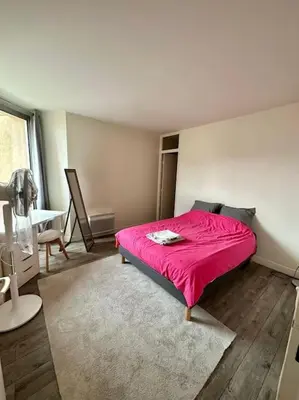 Un ou plusieurs lits dans un hébergement de l'établissement Appartement 58m2 lumineux en face du Parc des expositions