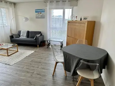 Coin salon dans l'établissement Appartement 58m2 lumineux en face du Parc des expositions