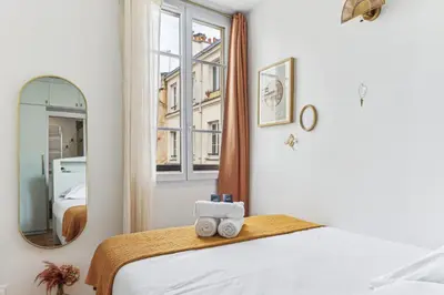 Un ou plusieurs lits dans un hébergement de l'établissement Appartement cosy au cœur du Marais
