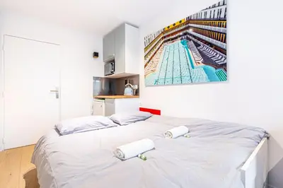 Un ou plusieurs lits dans un hébergement de l'établissement Charming stay in the 16th