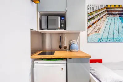 Cuisine ou kitchenette dans l'établissement Charming stay in the 16th