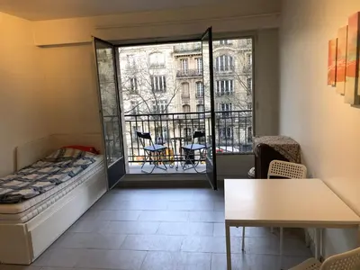 Un ou plusieurs lits dans un hébergement de l'établissement Beautiful studio next to metro