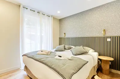 Un ou plusieurs lits dans un hébergement de l'établissement Résidence Centre de Paris by Studioprestige
