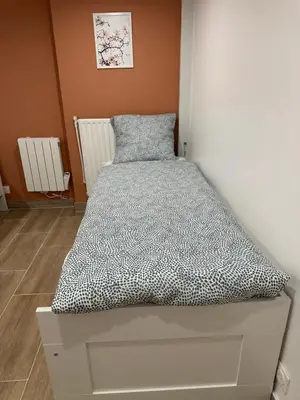 Un ou plusieurs lits dans un hébergement de l'établissement HL Home Paris Ivry
