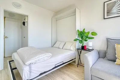Un ou plusieurs lits dans un hébergement de l'établissement Studio 4 people Accord Arena Bercy