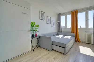 Un ou plusieurs lits dans un hébergement de l'établissement Studio 4 people Accord Arena Bercy