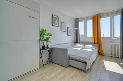 Un ou plusieurs lits dans un hébergement de l'établissement Studio 4 people Accord Arena Bercy