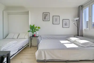 Un ou plusieurs lits dans un hébergement de l'établissement Studio 4 people Accord Arena Bercy