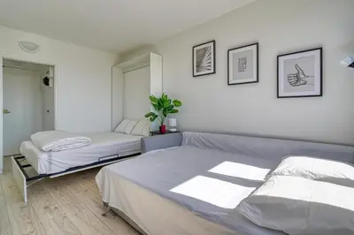 Un ou plusieurs lits dans un hébergement de l'établissement Studio 4 people Accord Arena Bercy