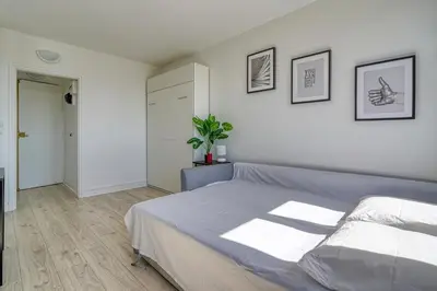 Un ou plusieurs lits dans un hébergement de l'établissement Studio 4 people Accord Arena Bercy