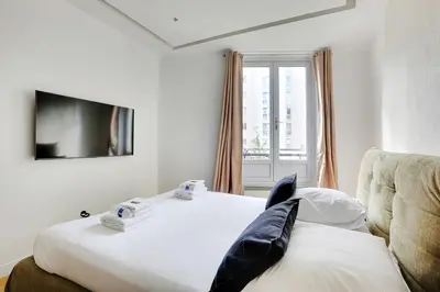 Un ou plusieurs lits dans un hébergement de l'établissement Cosy & chic studio - 2P - Levallois