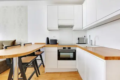 Cuisine ou kitchenette dans l'établissement Cosy & chic studio - 2P - Levallois