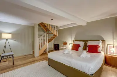 Un ou plusieurs lits dans un hébergement de l'établissement Place de la Nation Cozy 2BD Duplex