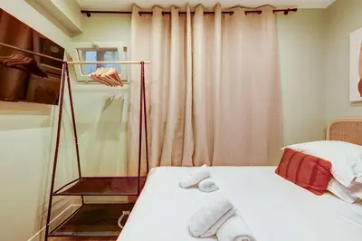Un ou plusieurs lits dans un hébergement de l'établissement Place de la Nation Cozy 2BD Duplex