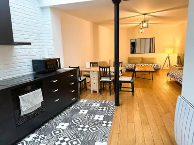 Coin salon dans l'établissement GRAND APPARTEMENT Paris 10
