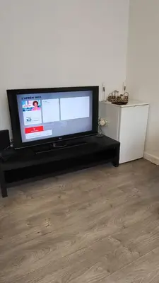 Télévision ou salle de divertissement dans l'établissement Apparemment parisien