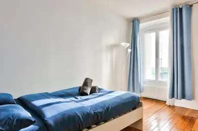 Un ou plusieurs lits dans un hébergement de l'établissement Appartement QUARTIER EMILY IN PARIS NOTRE DAME