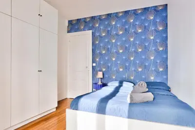 Un ou plusieurs lits dans un hébergement de l'établissement Appartement QUARTIER EMILY IN PARIS NOTRE DAME