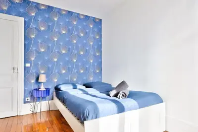 Un ou plusieurs lits dans un hébergement de l'établissement Appartement QUARTIER EMILY IN PARIS NOTRE DAME